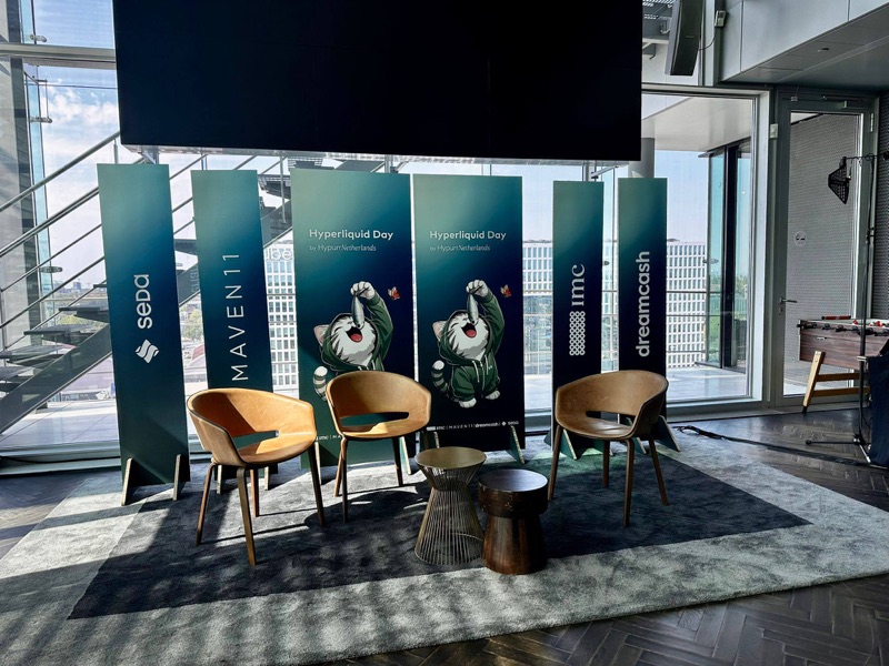 Sponsor banners and stage setup at Hyperliquid Day