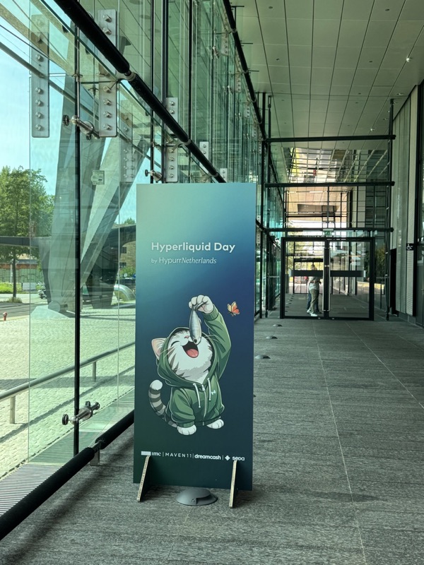 Hyperliquid Day roll-up banner at the entrance